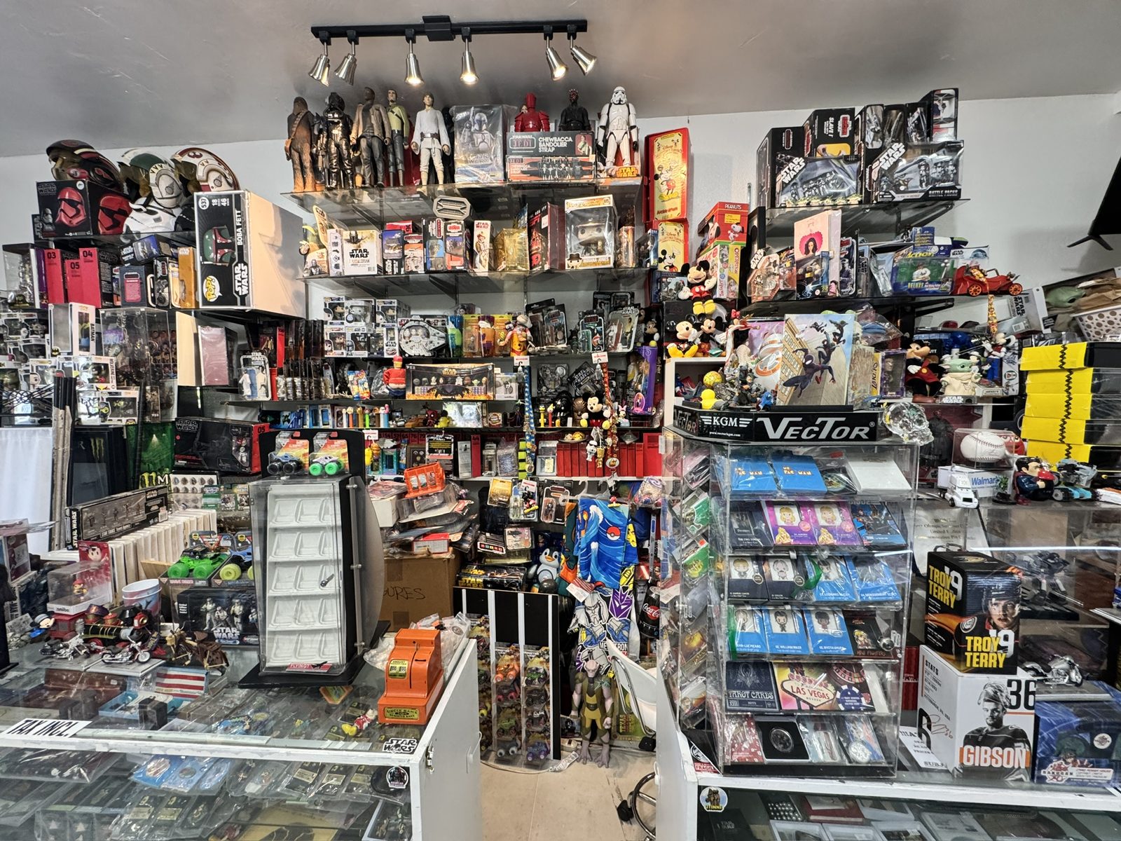 Display wall of coins and memorabilia at Dadd's